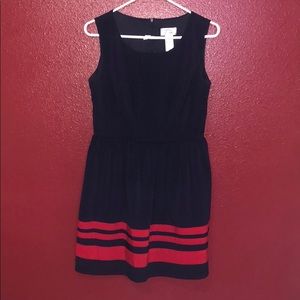 Selling this navy blue dress with a 3 red stripes.